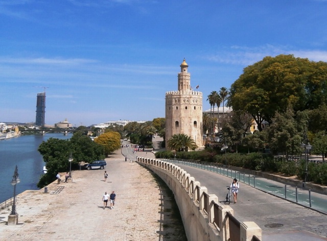 The Gold Tower was built during Moorish rule in the early 13th century to guard access along the Guadalquivir River.  The tower's lime mortar gave off a golden glow in the evening sun which led to its name, the Torre del Oro.